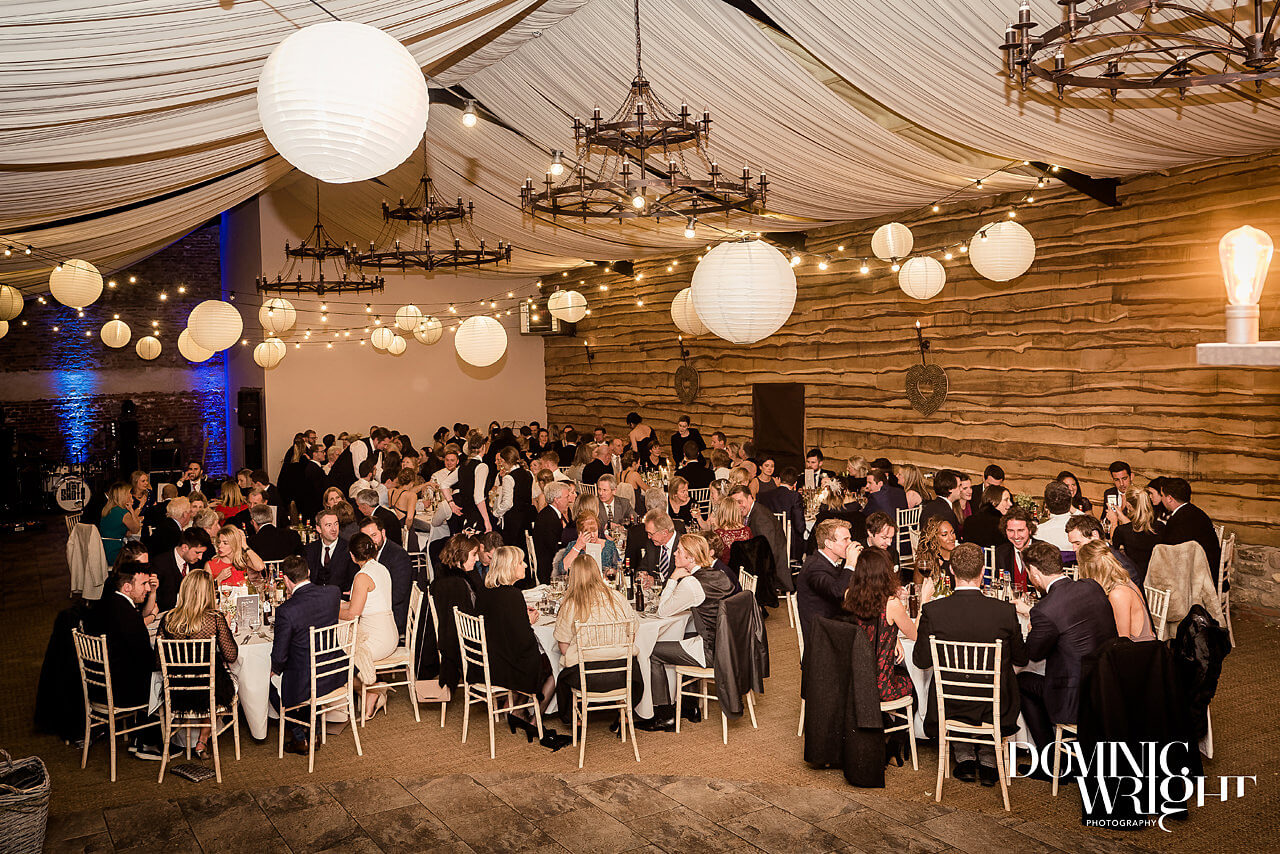 Warm lights, elegant décor and lots of fun at Lucy and Raife's wedding. Photography by Dominic Wright.